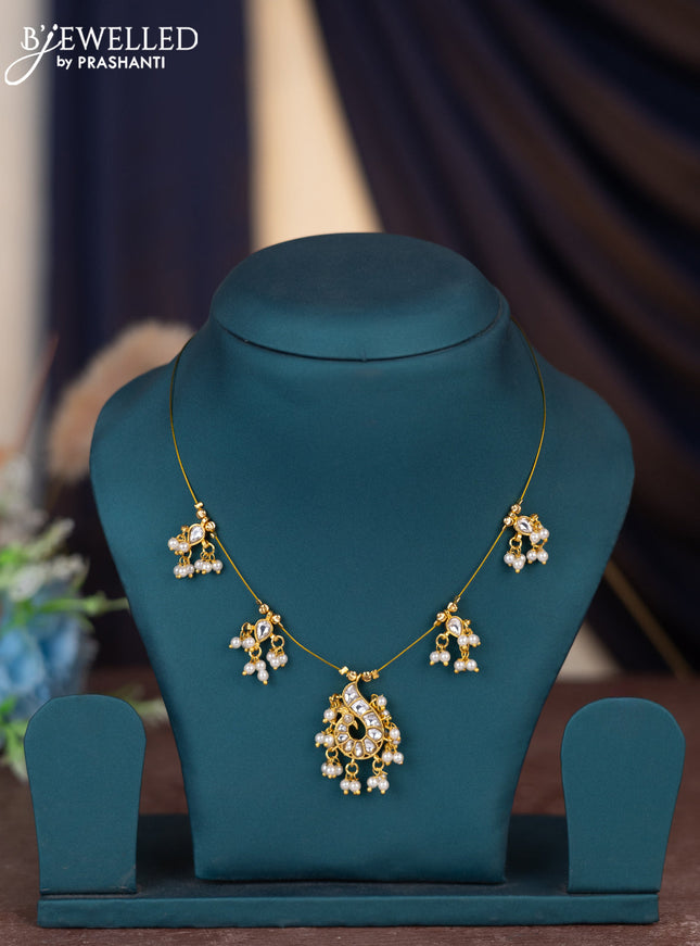 Invisible chain peacock design with kundan stones and pearl hangings without earring