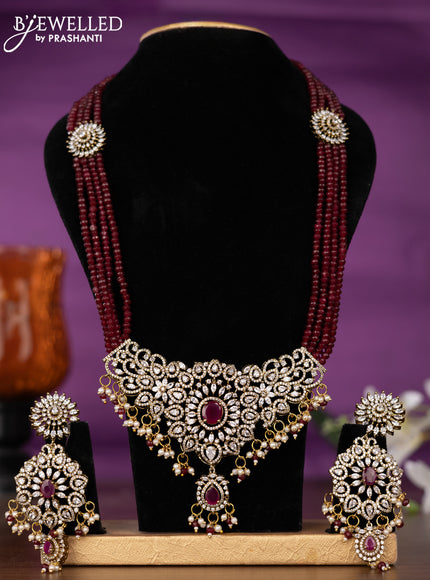 Beaded multilayer maroon necklace with ruby & cz stones and pearl & beads hangings in victorian finish