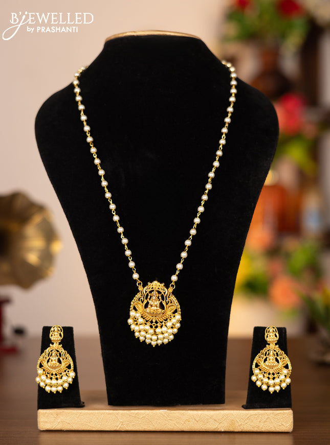 Pearl necklace with lakshmi pendant and pearl hangings