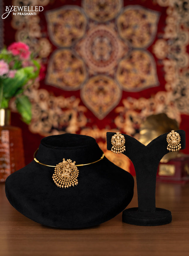 Antique ring type choker with lakshmi pendant and golden beads hangings
