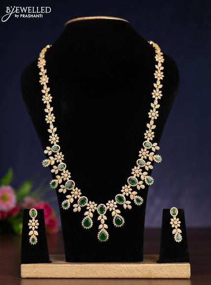 Zircon haram with emerald and cz stones in gold finish