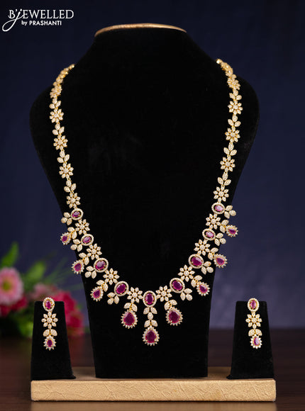 Zircon haram with ruby and cz stones in gold finish