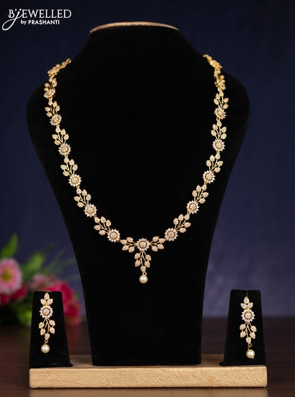 Zircon haram with cz stones and pearl hanging in gold finish