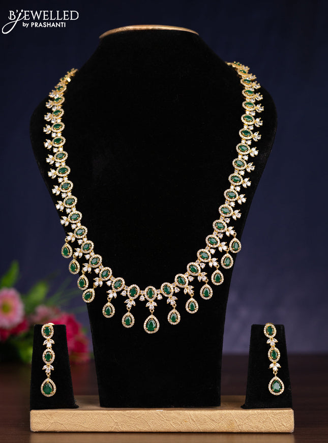 Zircon haram with emerald and cz stones in gold finish