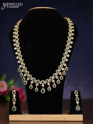Zircon haram with emerald and cz stones in gold finish