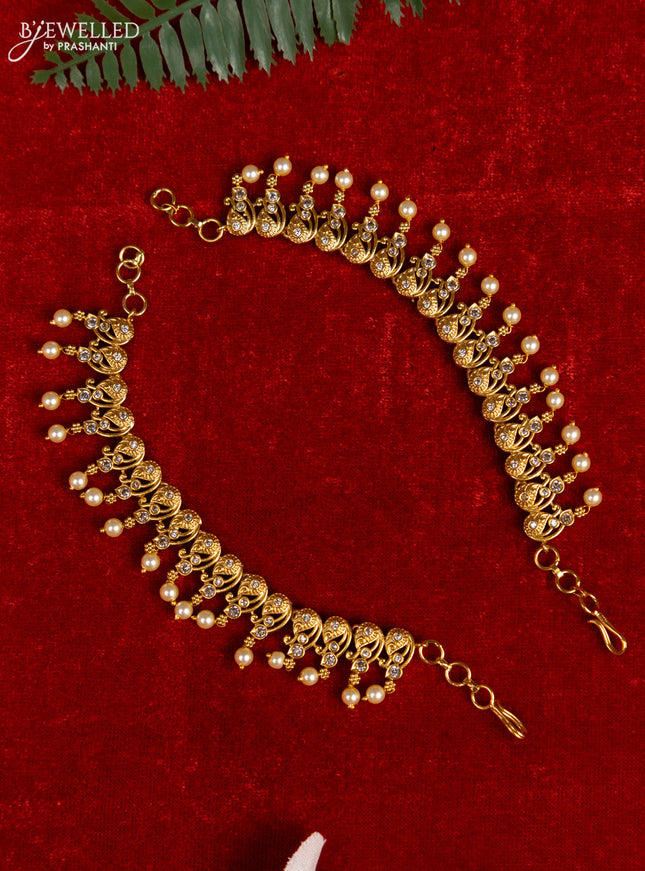 Antique mattal with cz stones and pearl hangings