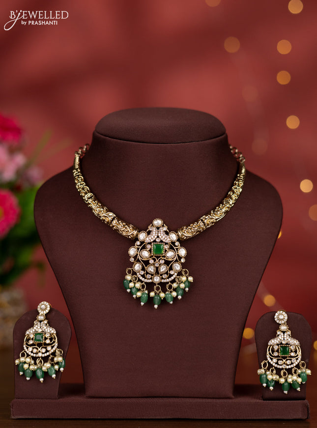 Necklace with emerald & kundan cz stones and green beads hangings in victorian finish