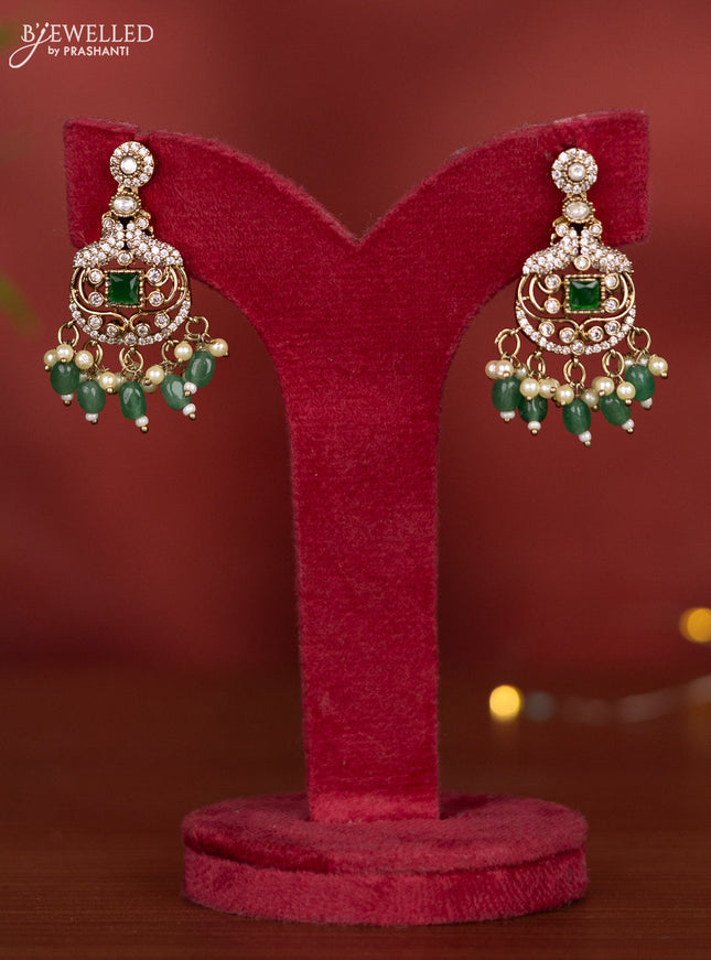Necklace with emerald & kundan cz stones and green beads hangings in victorian finish