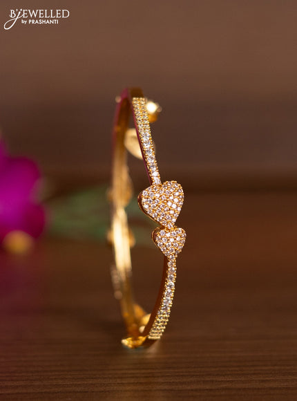 Bracelets heart shape design with cz stones and hangings in gold finish