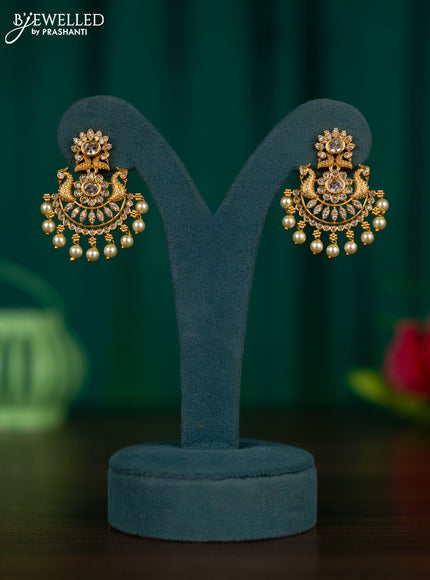Antique earrings peacock design with cz stones and pearl hangings