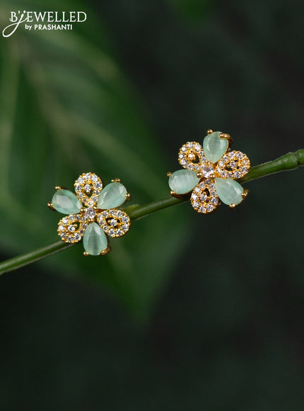 Zircon earrings with mint green and cz stones in gold finish