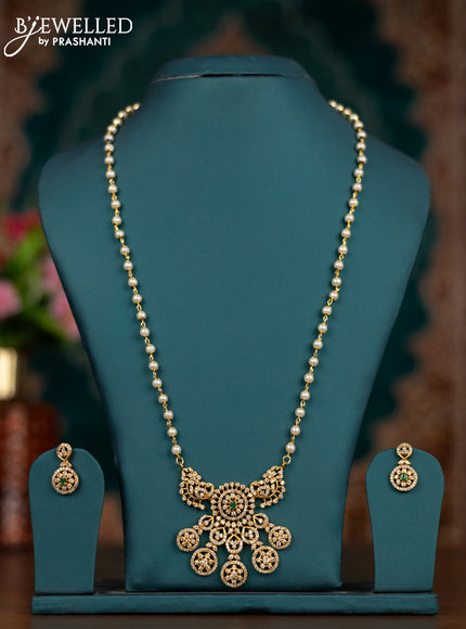 Pearl necklace with emerald and cz stones