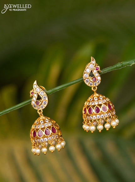 Antique jhumka peacock design with pink kemp & cz stones and pearl hangings