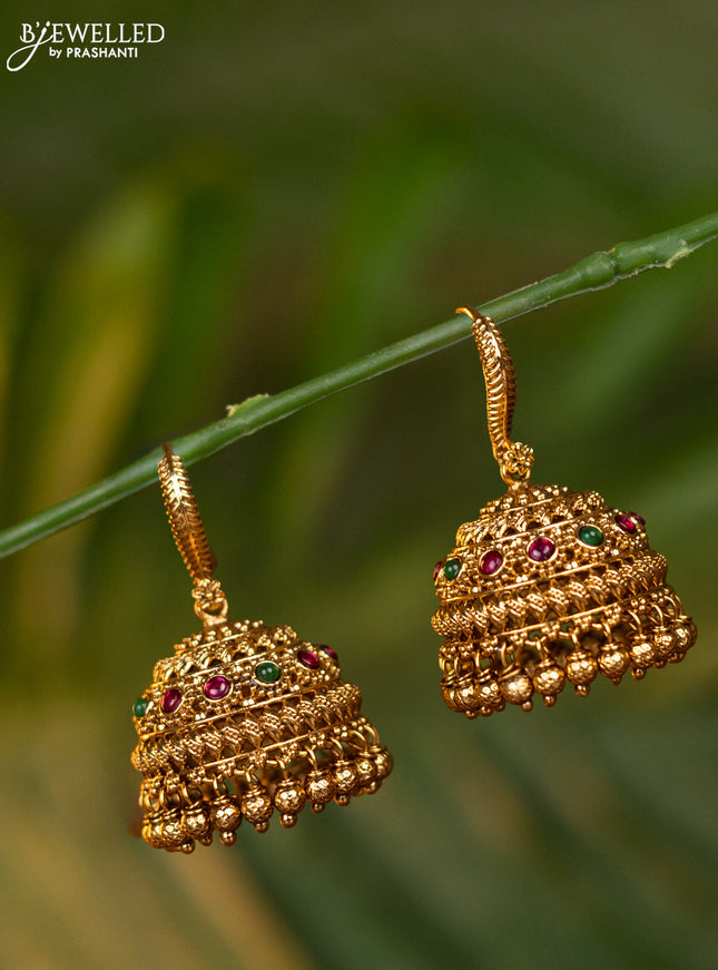 Antique hanging type jhumka with kemp stones and golden beads hangings