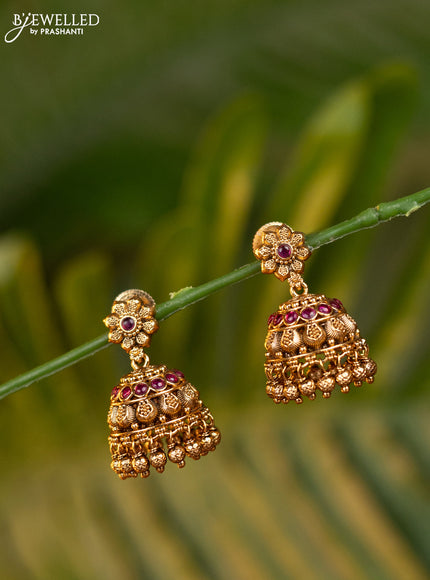 Antique jhumka with pink kemp stones and golden beads hangings