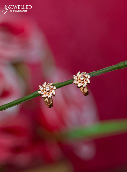 Rosel gold hanging type earrings with floral design and cz stones