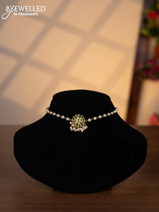 Pearl choker with green jadau kundan stones and pearl hangings without earrings