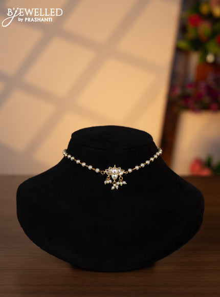 Pearl choker lotus design with kundan stones and pearl hangings without earrings