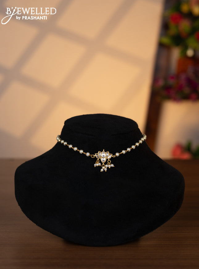 Pearl choker lotus design with kundan stones and pearl hangings without earrings