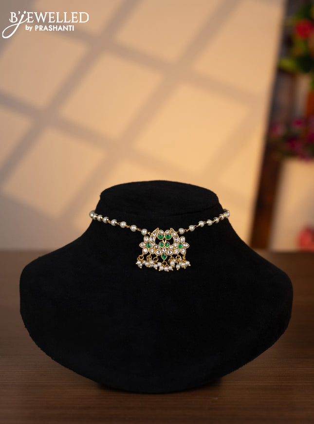 Pearl choker with green jadau kundan stones and pearl hangings without earrings