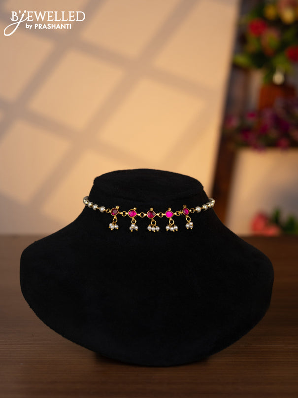 Pearl choker with pink jadau stones and pearl hangings without earrings