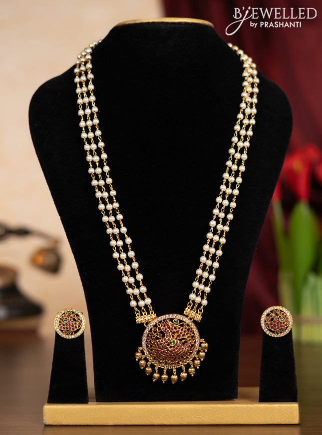 Pearl triple layer haaram peacock design with kemp & cz stones and golden beads hangings