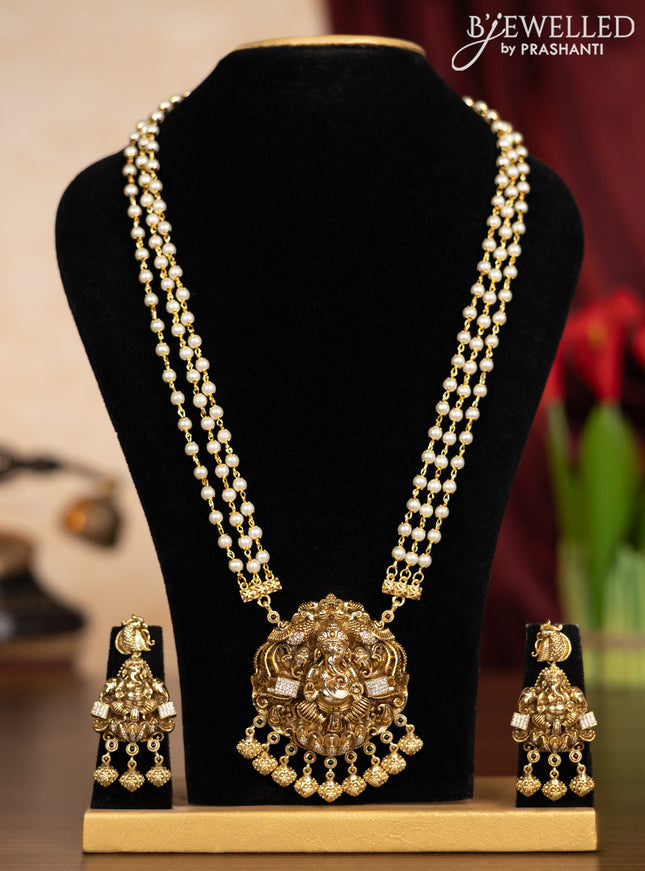 Pearl triple layer haaram ganesha pendant with kemp & cz stones and hangings