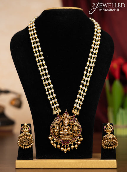 Pearl triple layer haaram lakshmi pendant with pink kemp stones and golden beads hangings