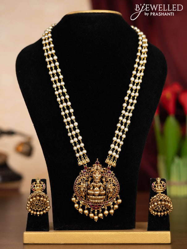 Pearl triple layer haaram lakshmi pendant with pink kemp stones and golden beads hangings