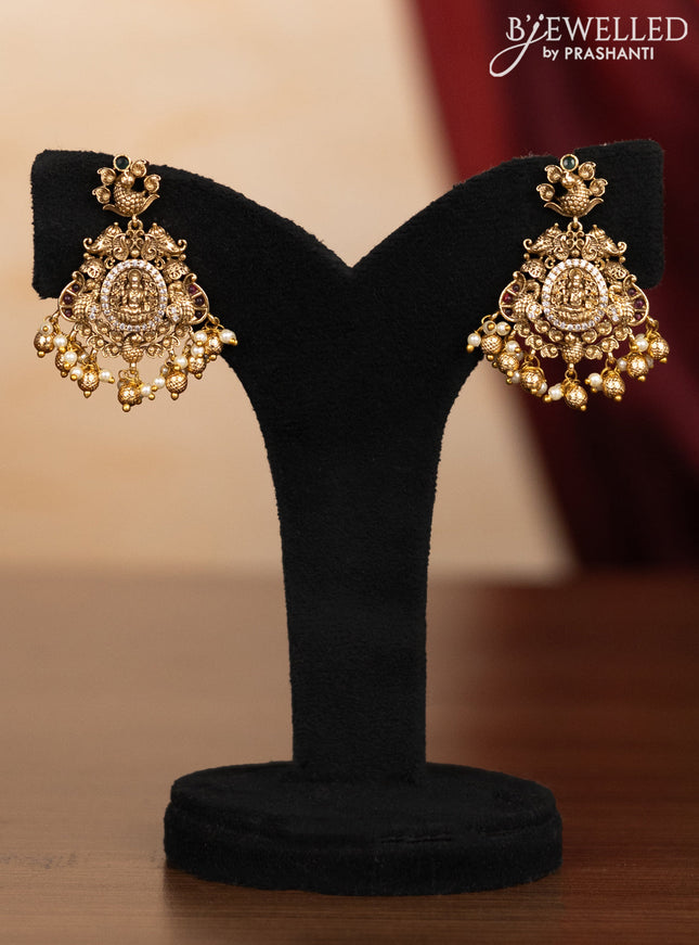 Pearl triple layer haaram lakshmi pendant with kemp & cz stones and pearl & golden beads hangings