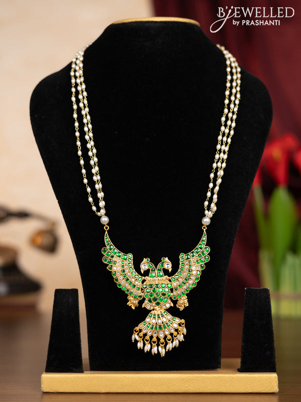 Pearl triple layer haaram garuda pendant with green jadau kundan stones andd pearl hangings without earrings