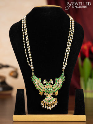 Pearl triple layer haaram garuda pendant with green jadau kundan stones andd pearl hangings without earrings