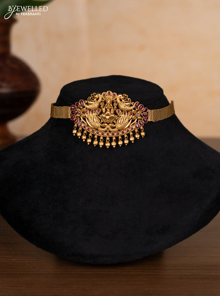 Antique choker lakshmi design with ruby stones and golden beads hangings