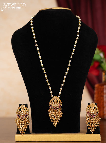 Pearl necklace lakshmi pendant with ruby stones and golden beads hangings