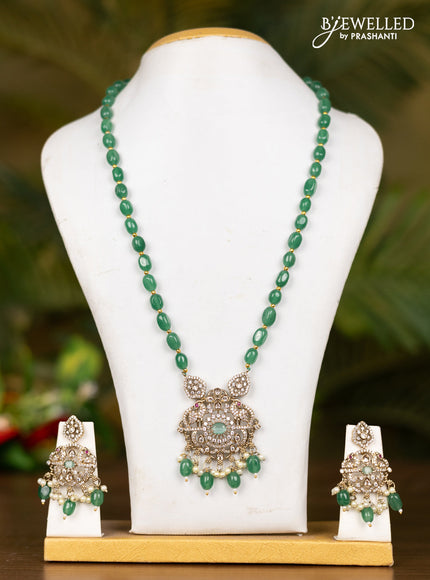 Beaded mint green necklace with double peacock pendant in victorian finish