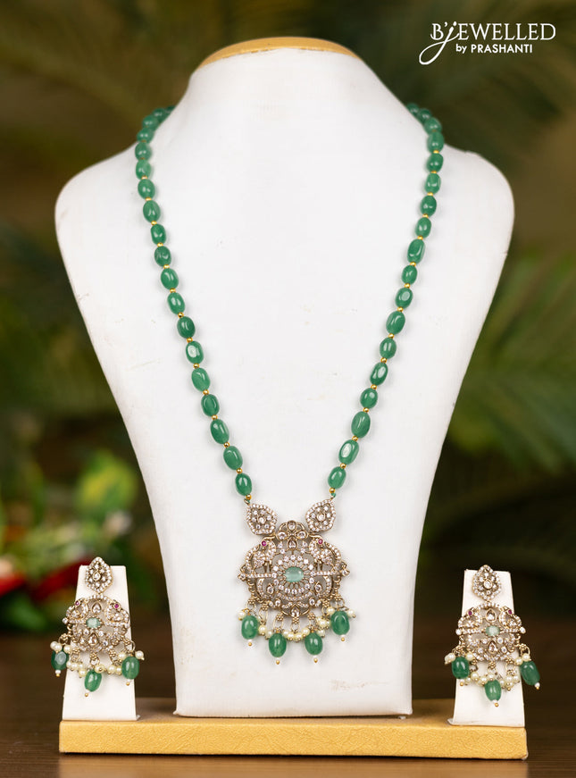 Beaded mint green necklace with double peacock pendant in victorian finish