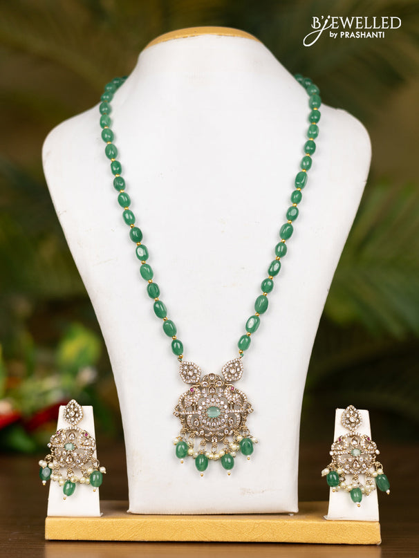 Beaded mint green necklace with double peacock pendant in victorian finish