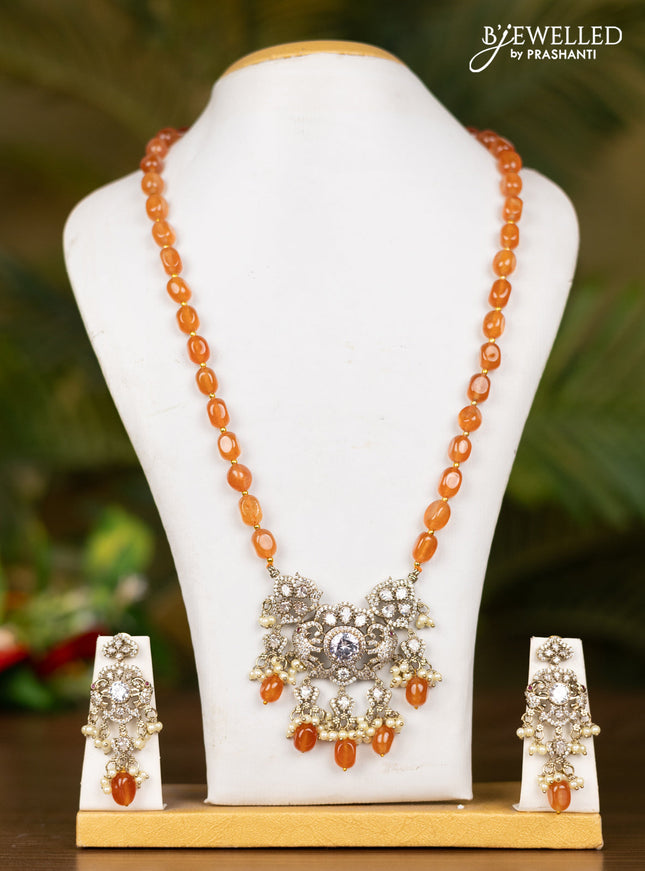 Beaded orange necklace with elephant pendant in victorian finish