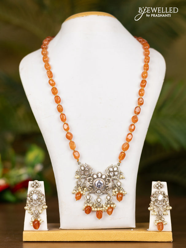 Beaded orange necklace with elephant pendant in victorian finish