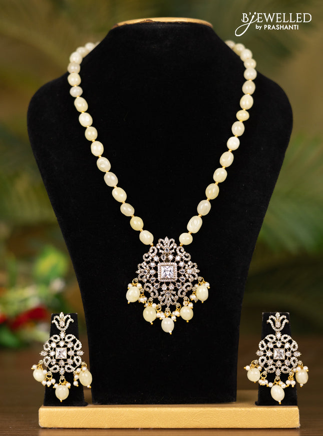 Beaded yellow necklace with floral pendant in victorian finish