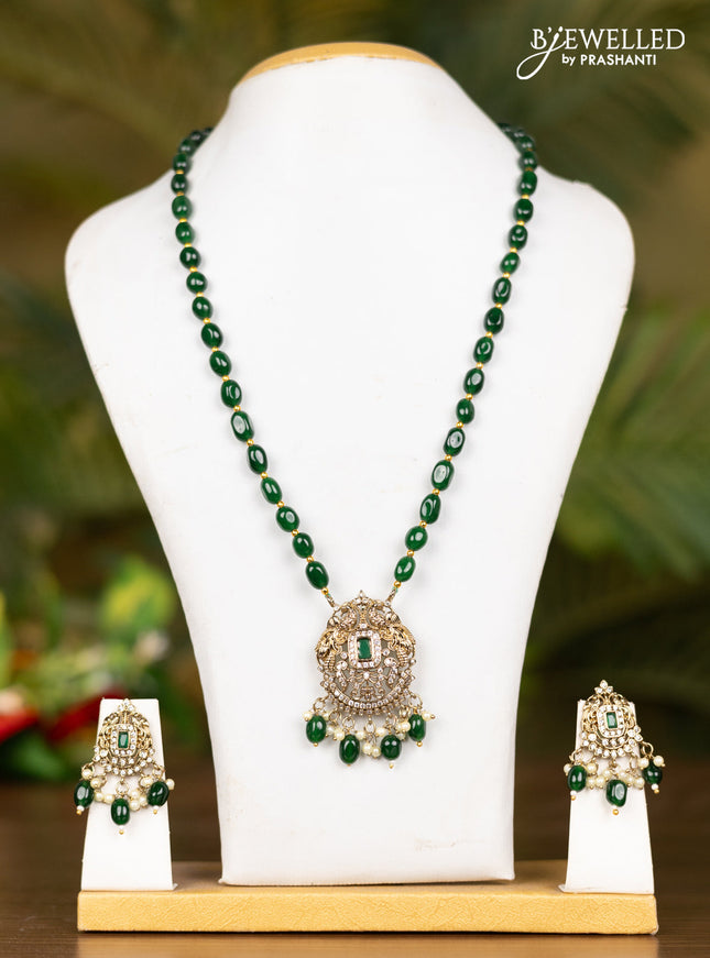Beaded dark green necklace with double peacock pendant in victorian finish