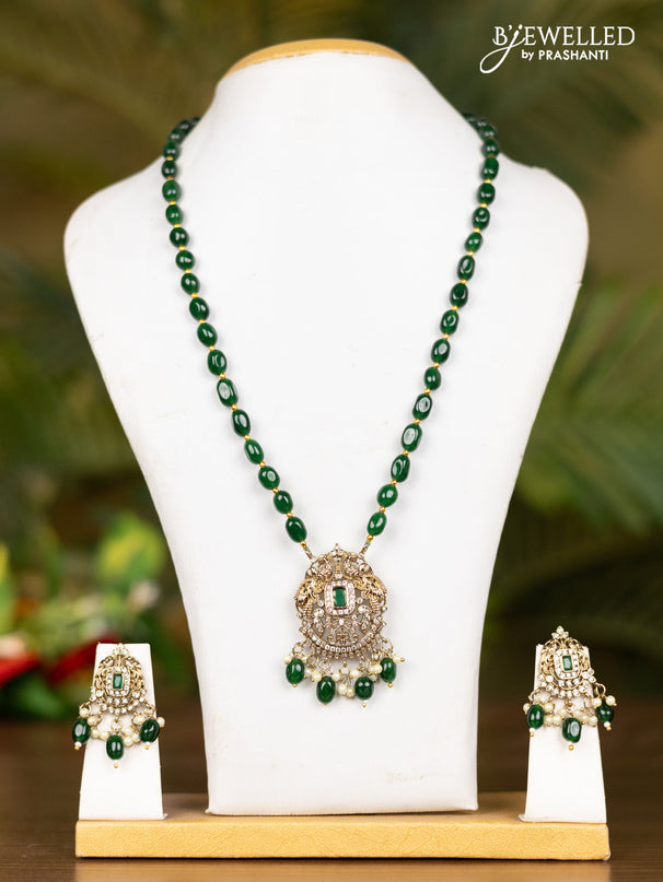 Beaded dark green necklace with double peacock pendant in victorian finish