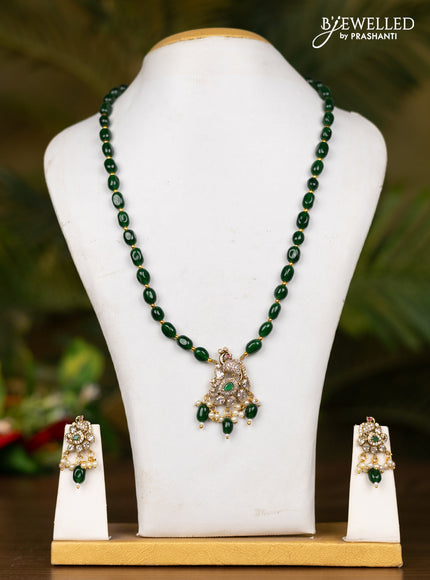 Beaded dark green necklace with peacock pendant in victorian finish