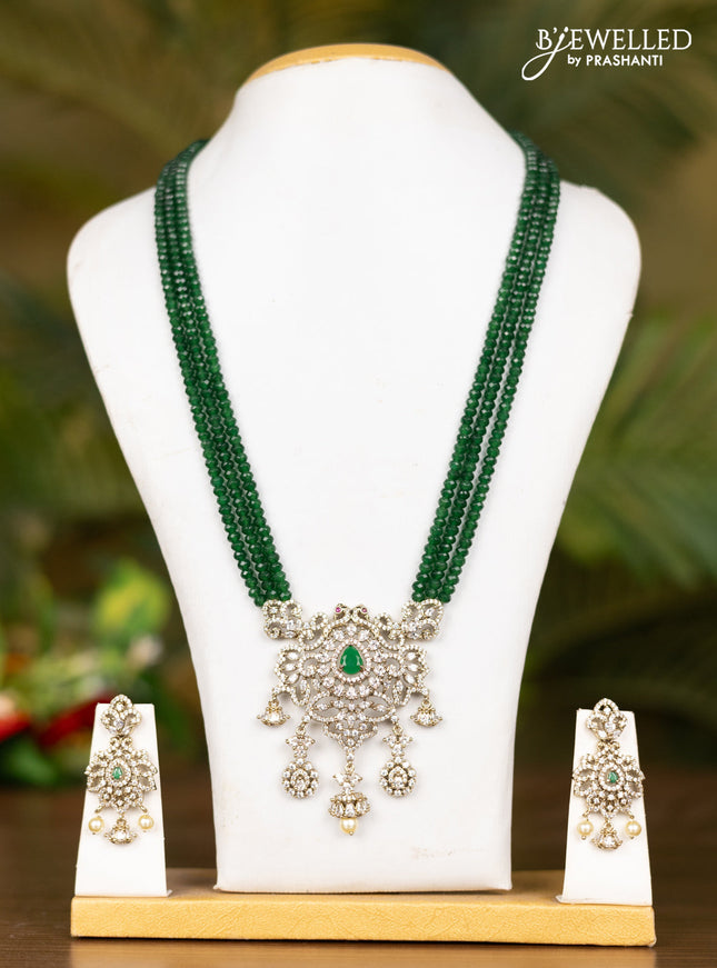 Beaded triple layer dark green necklace with floral pendant in victorian finish