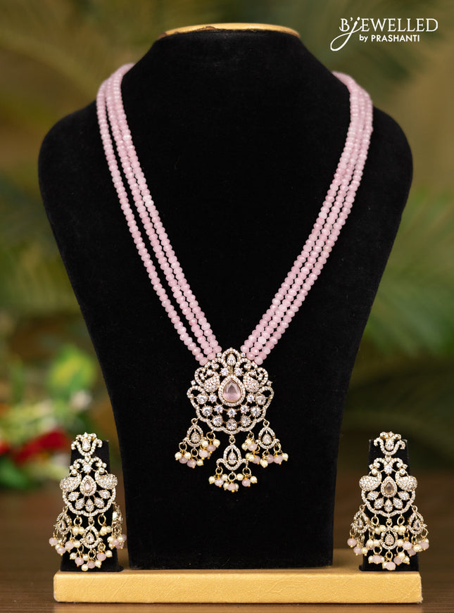 Beaded triple layer baby pink necklace with double peacock pendant in victorian finish