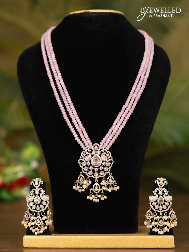 Beaded triple layer baby pink necklace with double peacock pendant in victorian finish