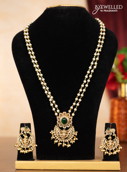 Pearl double layer haaram ganesha pendant with emerald & cz stones and pearl & golden beads hangings