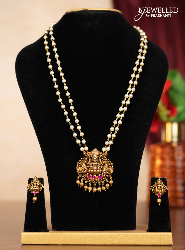 Pearl double layer haaram lakshmi pendant with pink jadau stones and golden beads hangings