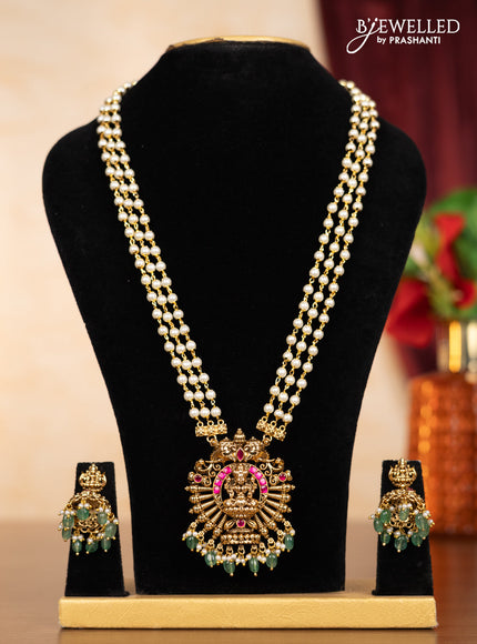 Pearl triple layer haaram lakshmi pendant with pink jadau stones and mint green beads hangings