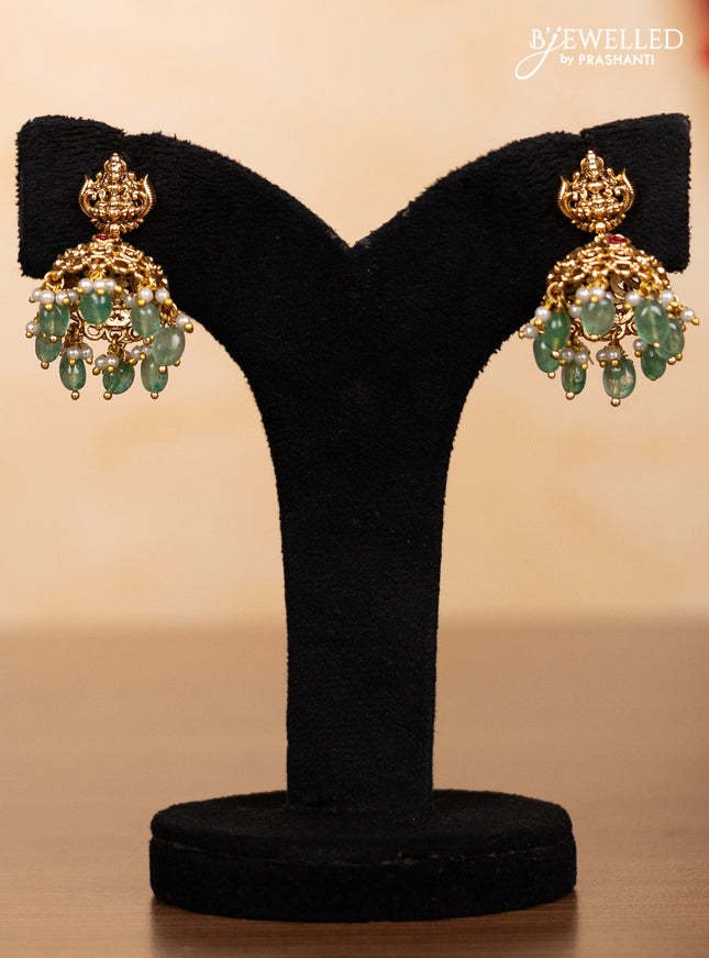 Pearl triple layer haaram lakshmi pendant with pink jadau stones and mint green beads hangings